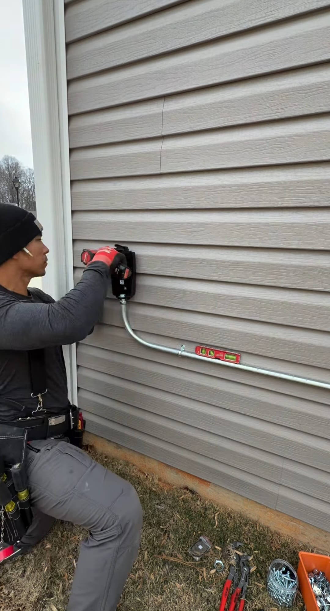 Tony Gorton on-site installing EV charger conduit
